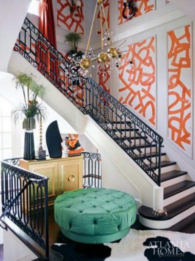 Kelly Wearstler's graffitti wallpaper in orange is quite dramatic in this staircase