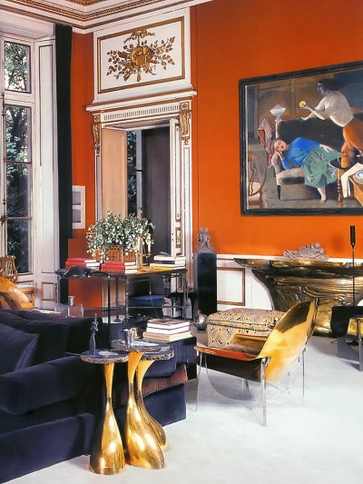This vibrant Henri Samuel Parisian drawing room looks fresh and new with orange walls and contemporary furniture
