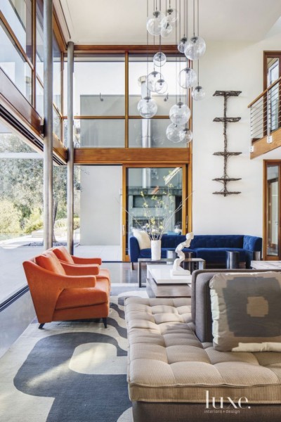 These orange chairs pop during summer and again come to life in Autumn in this contemporary home