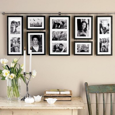 Keeping your galley wall symmetrical and orderly is another contemporary option that is easy to enjoy. A great option for family photos in a sleeping or less formal area of your home.