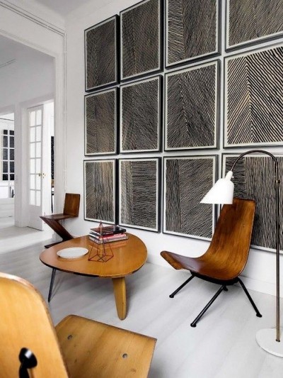 This block print gallery wall plays perfectly with the modernist organic furniture and the clean all white slate.