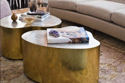 Artfully sculptural tables can make quite a statement in a classic room.